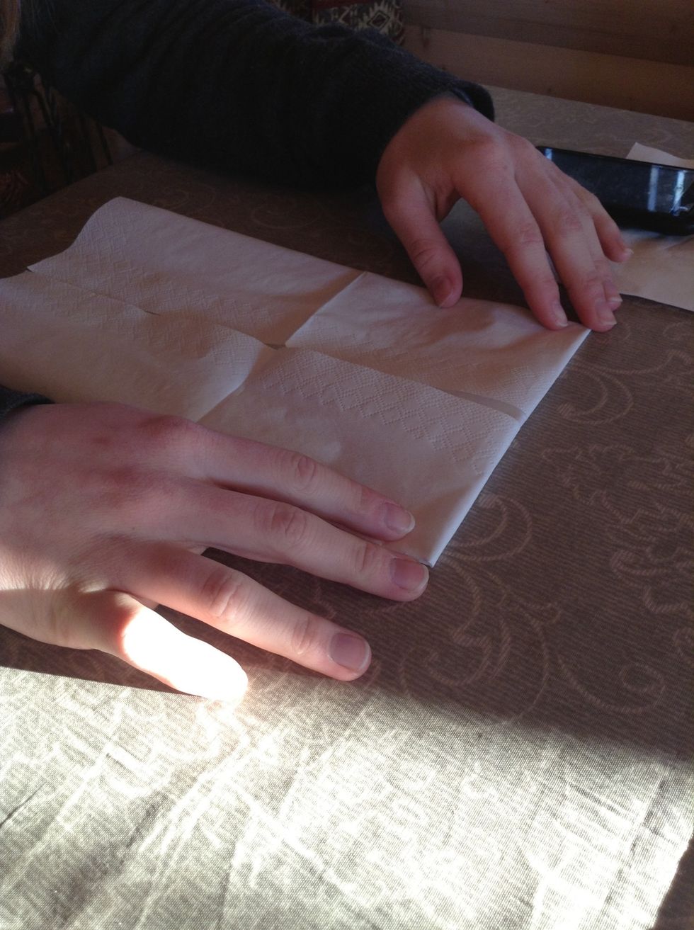 Turn the napkin around.