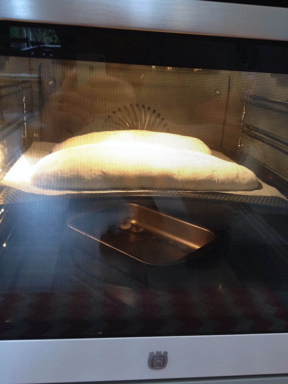 Turn the oven down to 250 degrees and in with the bread! Throw 2-3 icecubes at the bottom of the oven. After 10 minutes, turn the oven down to 200 degrees.