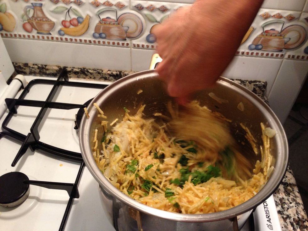 Turn the oven off to stop the eggs from overcooking and keep everything very moist. Add the fresh coriander and keep mixing.