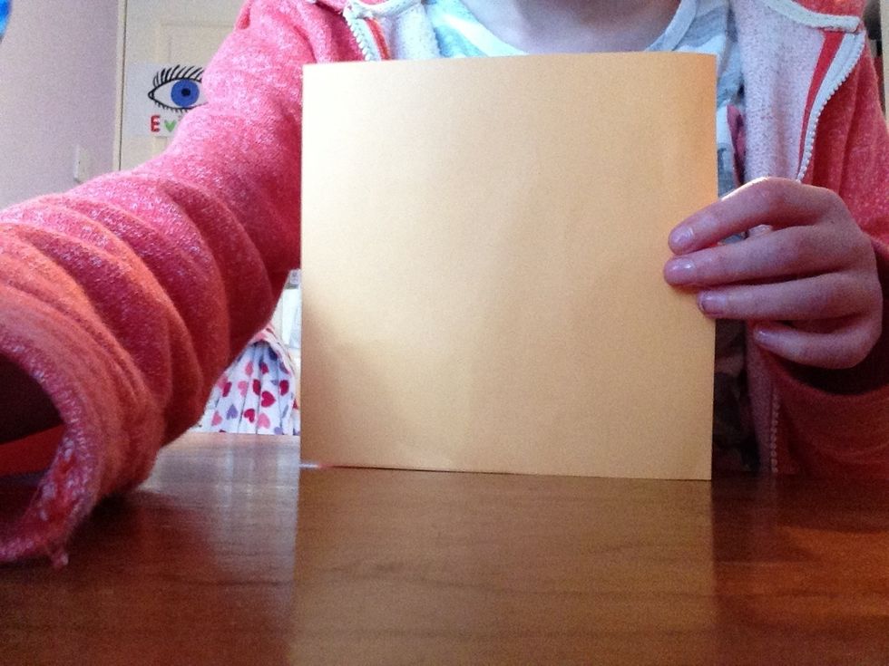 Turn the paper so that you have the white side facing upwards