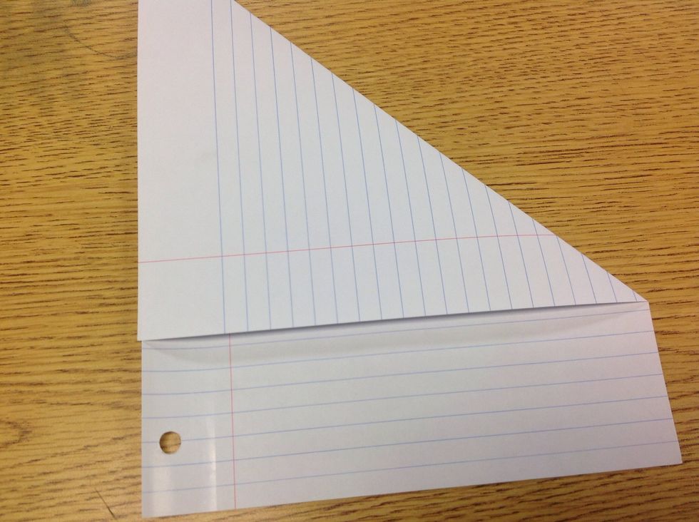 TURN THE PAPER UP AND FOLD OVER TH TOP MAKE SURE THAT ITS COMPLETELY ALIGNED WITH THE SIDE OF THE PAPER