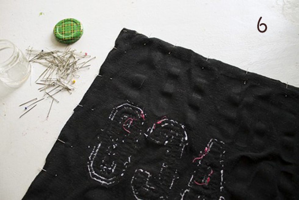 Turn the pieces of material inside out and pin together using straight pins. Place the pins perpendicular to the edges so the sewing machine can still run over them.