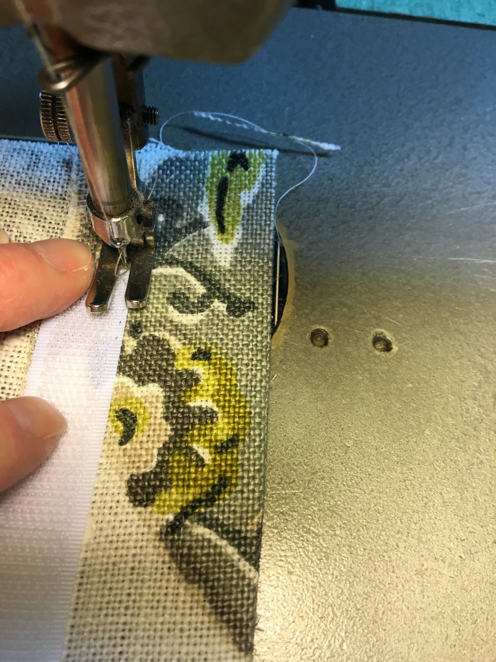 Turn the PILLOW BACK over and flip the folded flange back in place.  Beginning stitching at the edge of the PILLOW BACK continuing down the other side of the LOOP tape so that both sides are stitched.