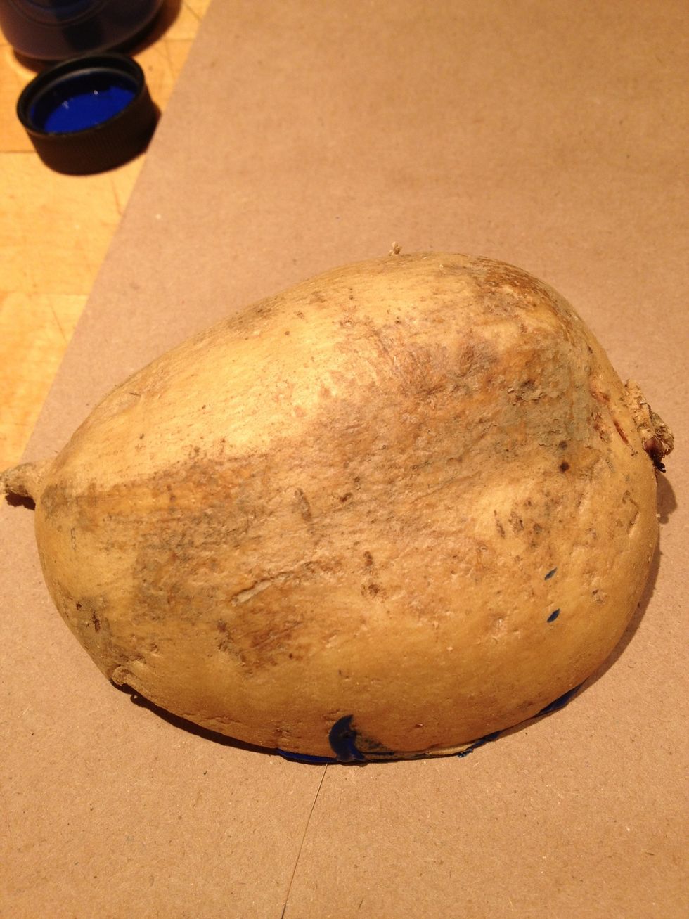 Turn the potato over and press onto the paper.