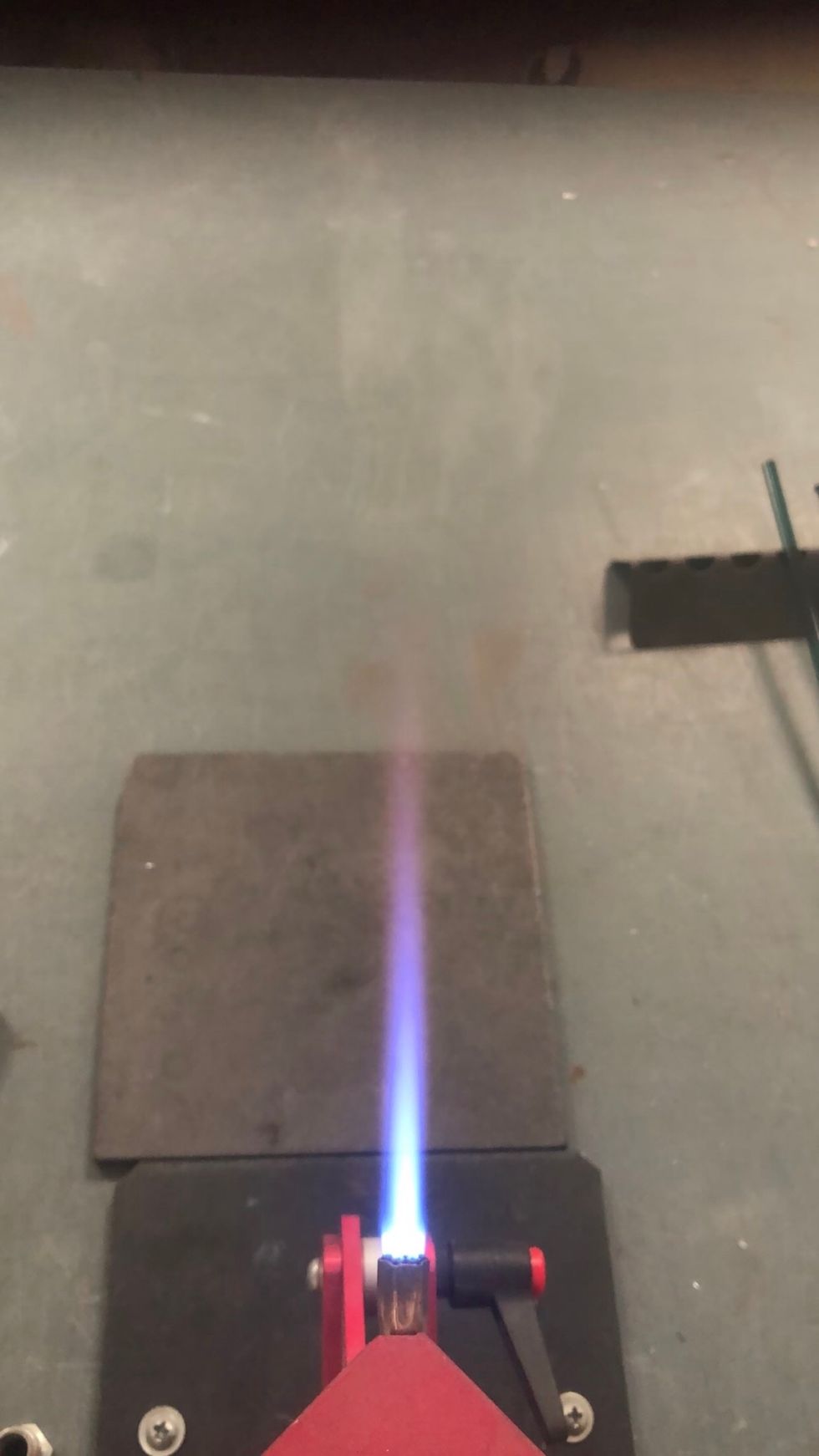 Turn the propane down again, creating a small, precise, narrow flame.