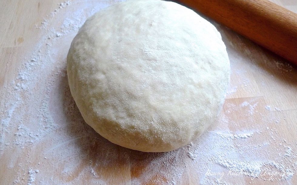 Turn the rested dough onto a lightly floured board.