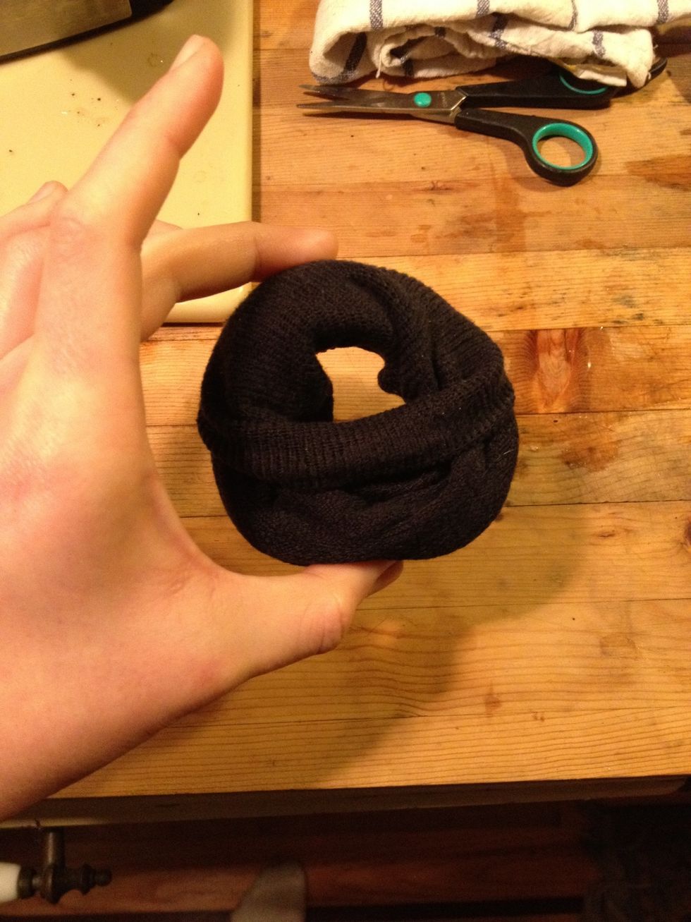 Turn the sock inside out until it forms a 'donut.'