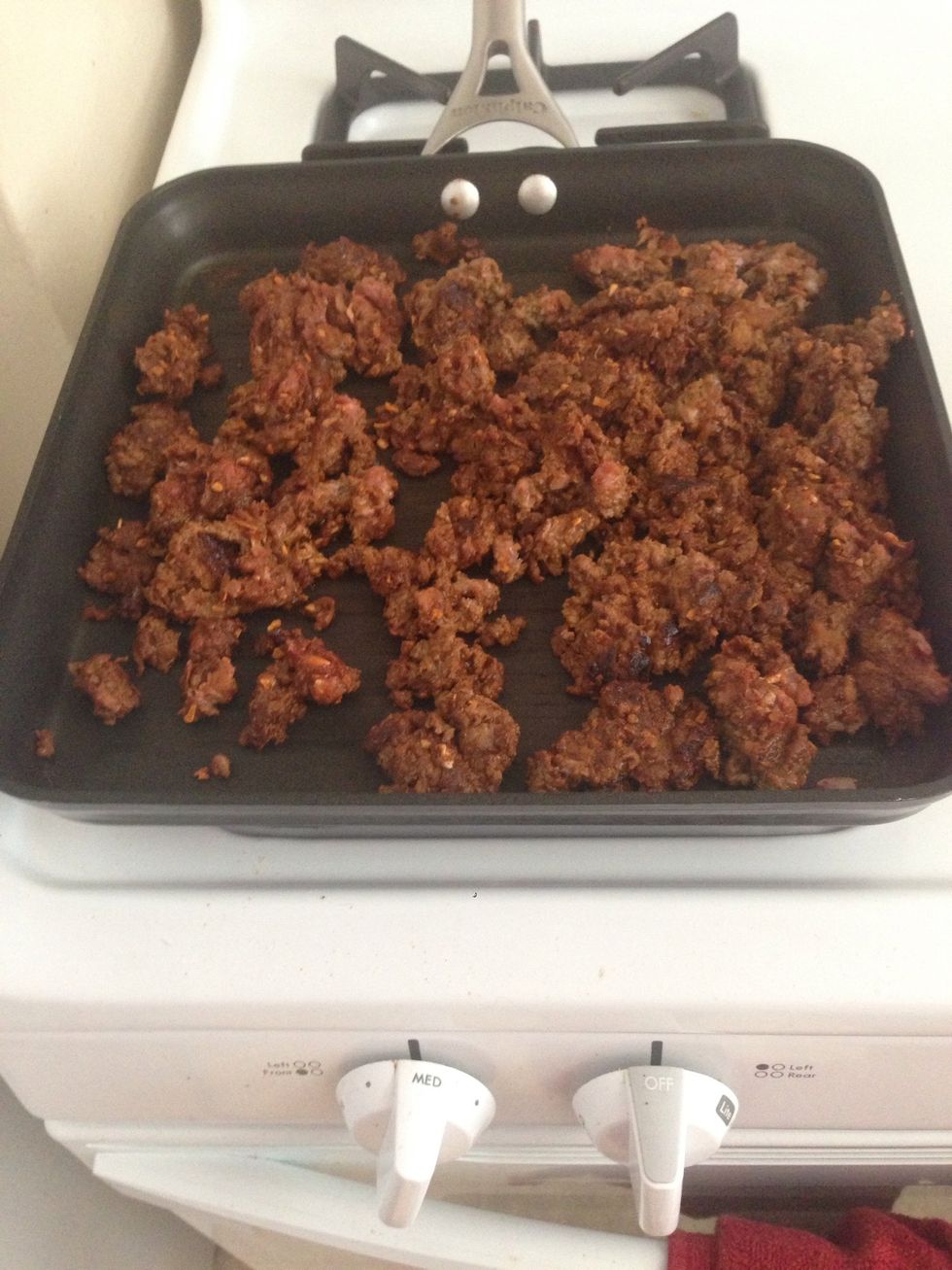 Turn the temperature down to medium and cook the taco meat for ~10 minutes. Make sure to break up the meat. If it has a little pink, that's ok since it will go into the oven.
