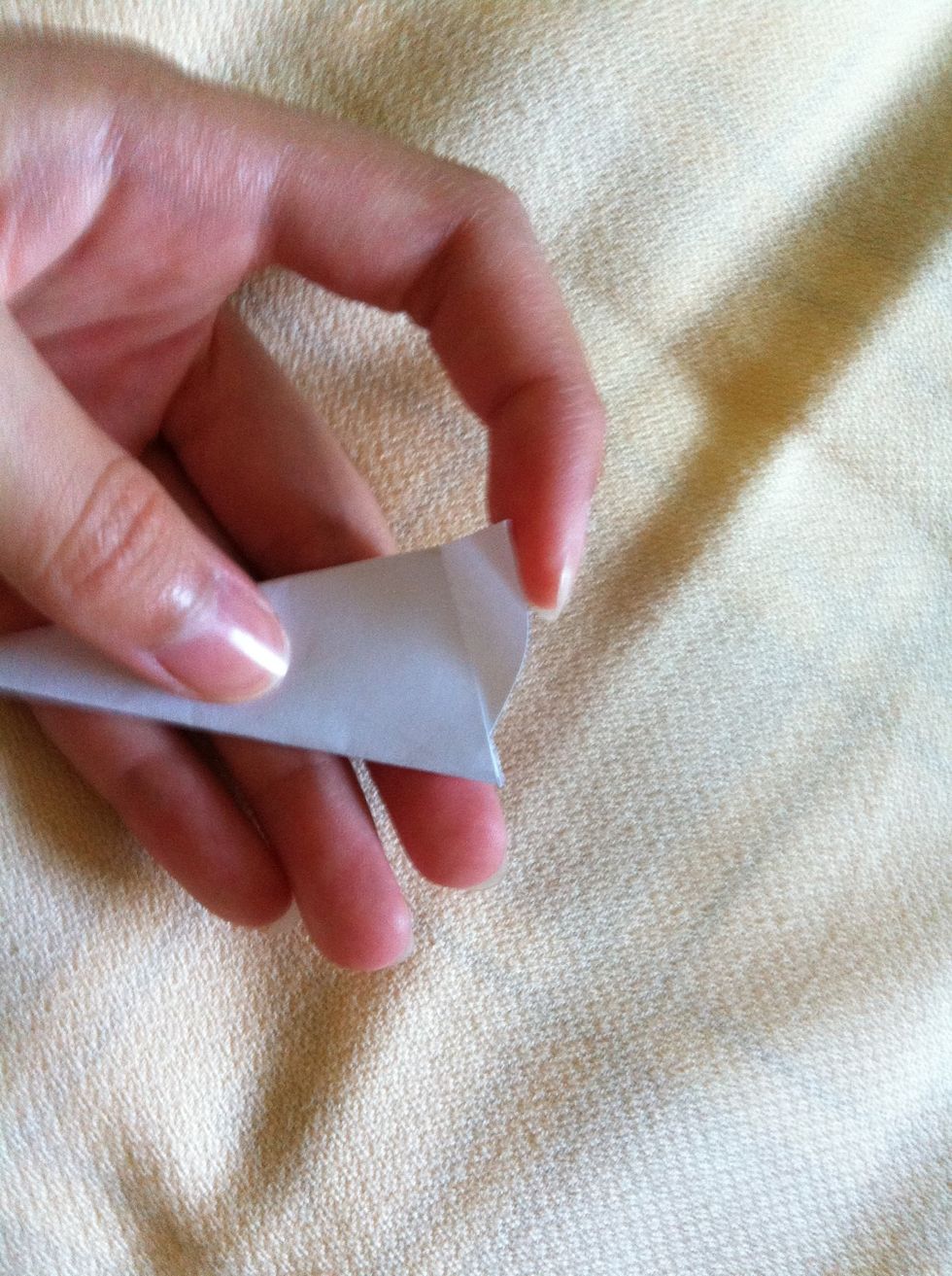 Turn to the front, and fold down the triangle at the front as well