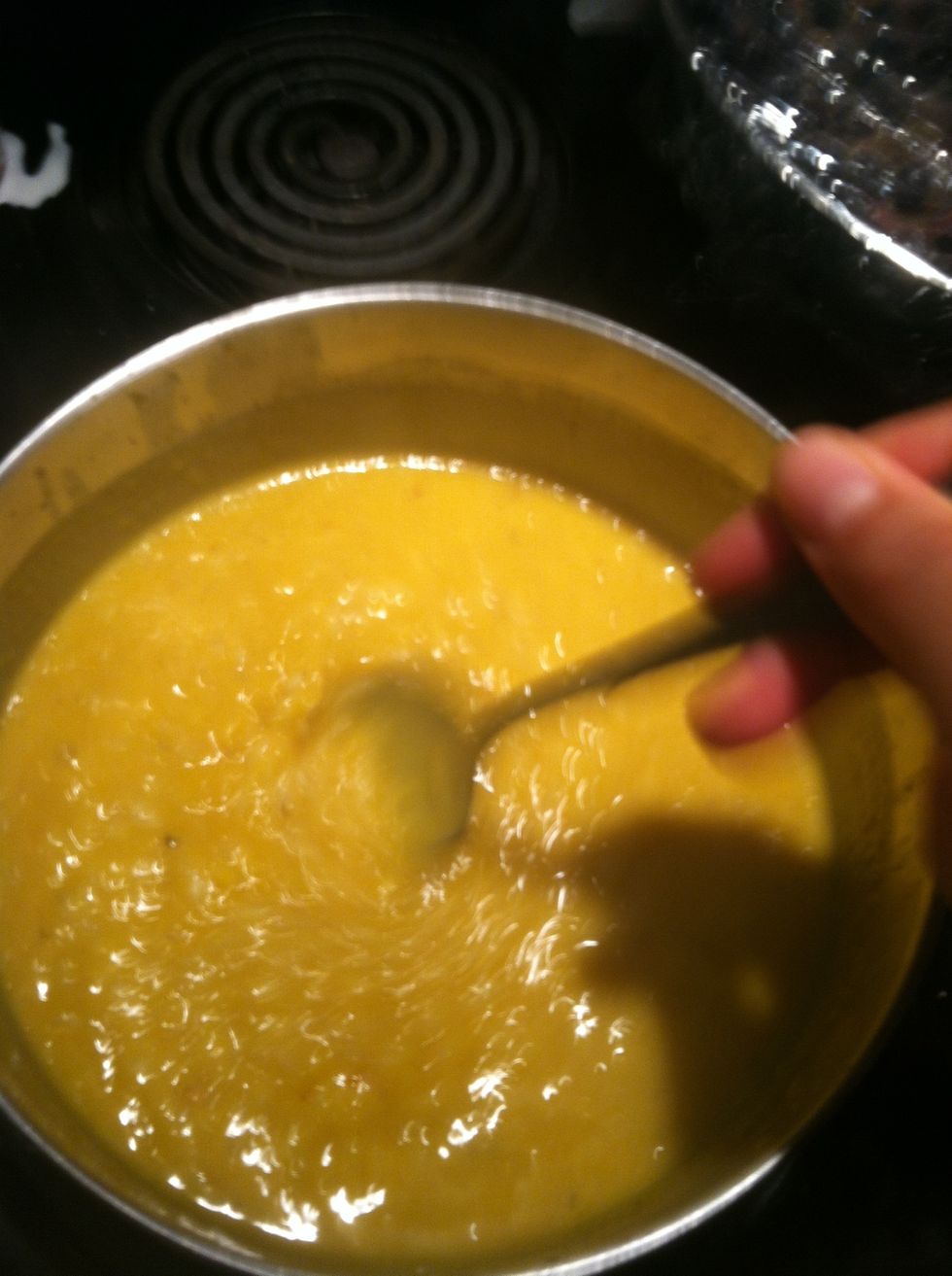 Turn up the heat a little bit, the pumpkin rice mixture should be bubbling slightly. Mix constantly and add milk . You want to coincide the doneness of the rice with the proper risotto consistency.