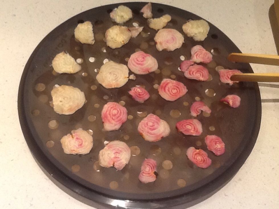 Turn with wooden tongs.