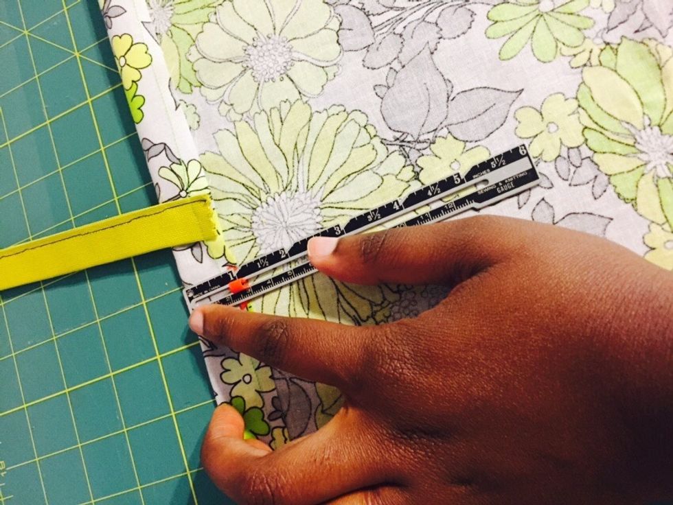 Turn your fabric right side down and measure about an inch (as shown in picture).