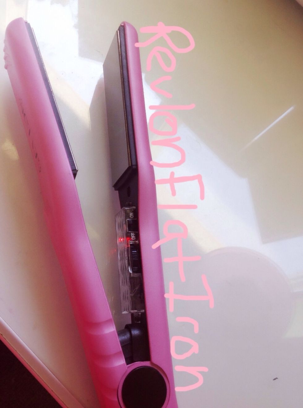 Turn your flat iron on and set it to the right heat setting for your hair type/thickness