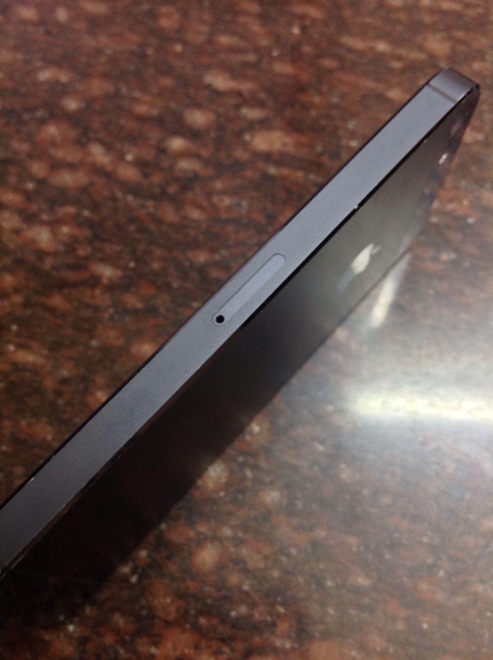 Turn your iPhone to the side which has the nano SIM slot