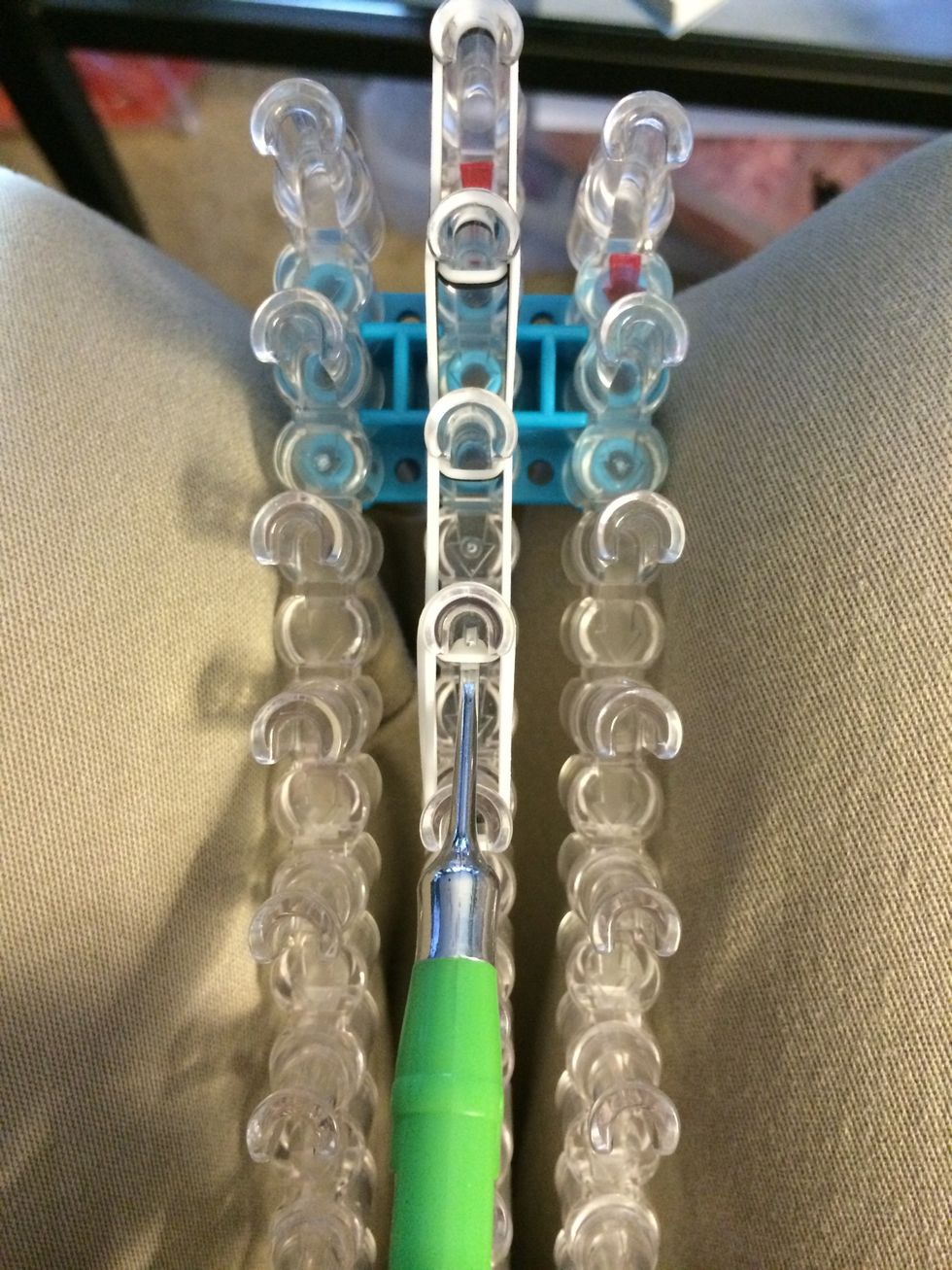 Turn your loom around and reach for the 3 white bands.