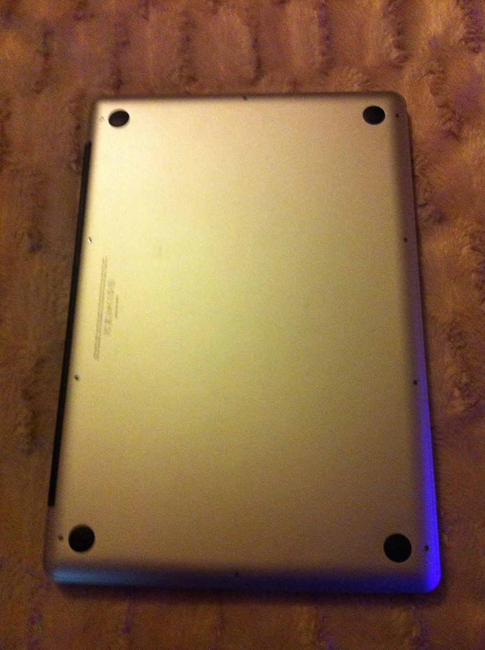 Turn your macbook over and remove all the screws with a plus head screwdriver