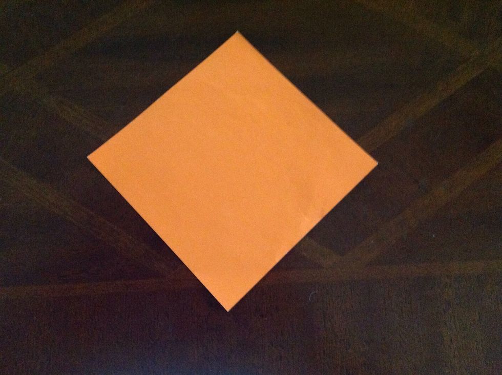 Turn your paper 45 degrees to make a diamond shape.