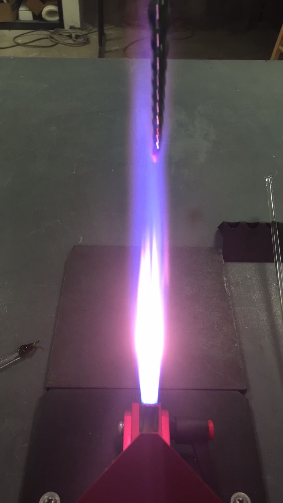 Turn your propane back up for a reduction flame, and apply a luster to the end of the icicle.