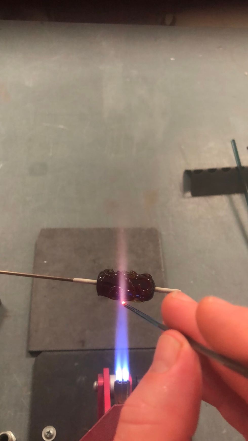 Turn your propane down yet again, and use a small, precise flame to apply dots wherever you think a dot should go without crowding the design.