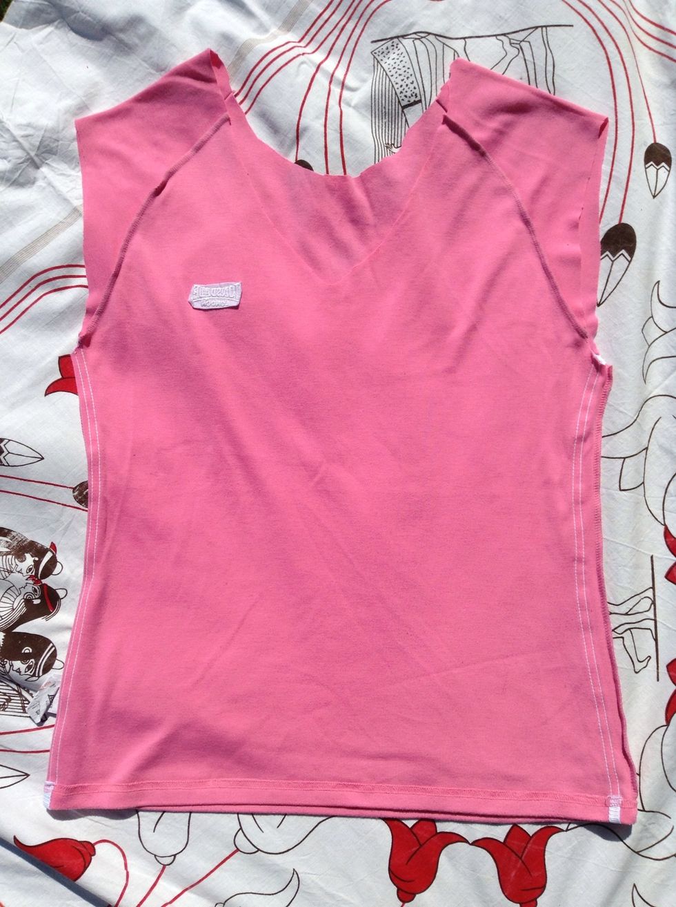 Turn your shirt inside out and lay it flat. If you'd like the fringe part of the bag to show, then you can leave it on the right side. Step 9 shows what that would look like.