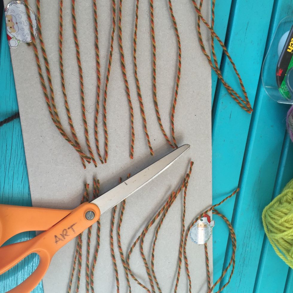 Turn your weaving over and cut the warp yarn. Take the weaving off the loom.