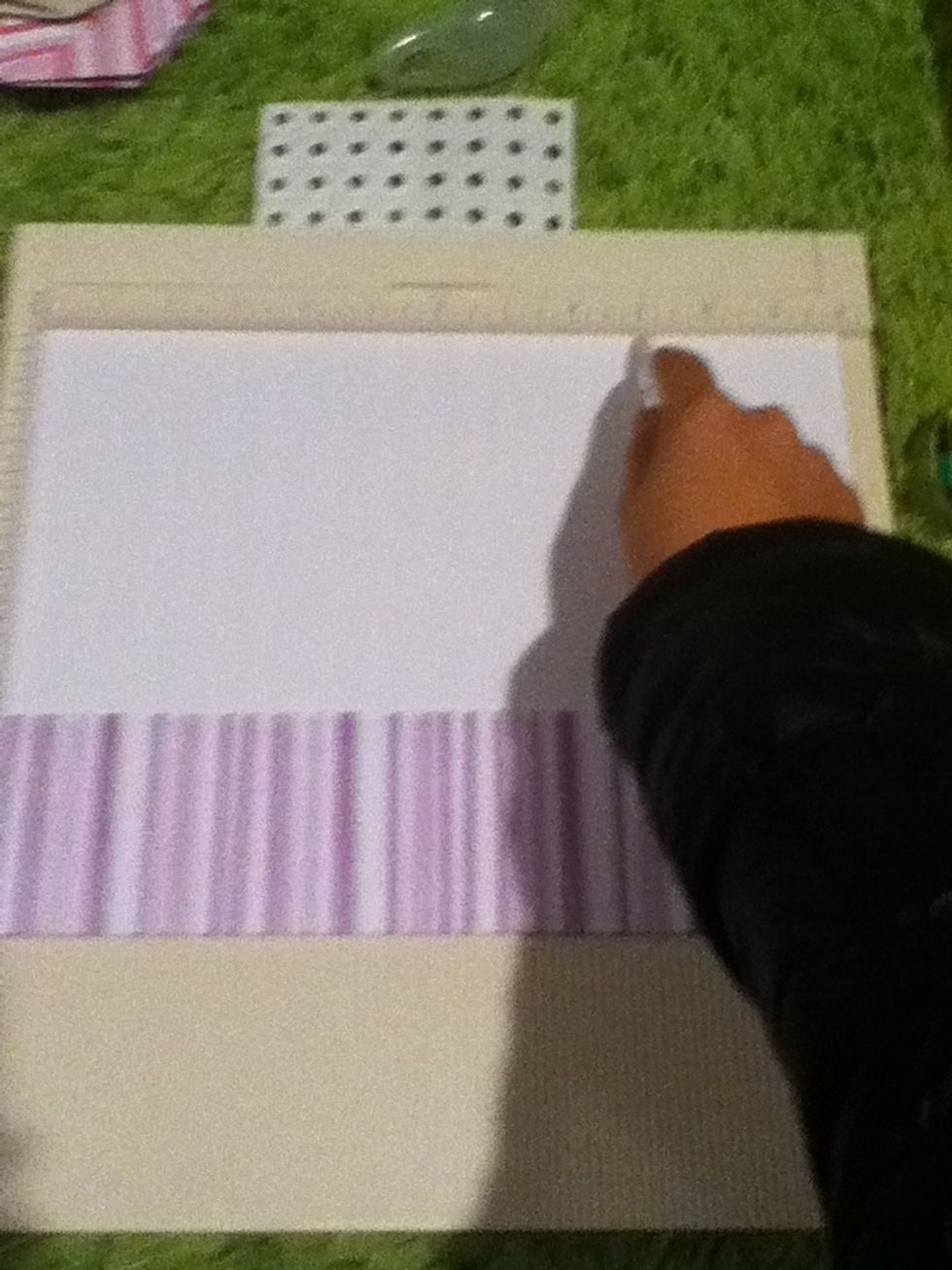 Turning the folded side down, score at three inches and at nine inches.