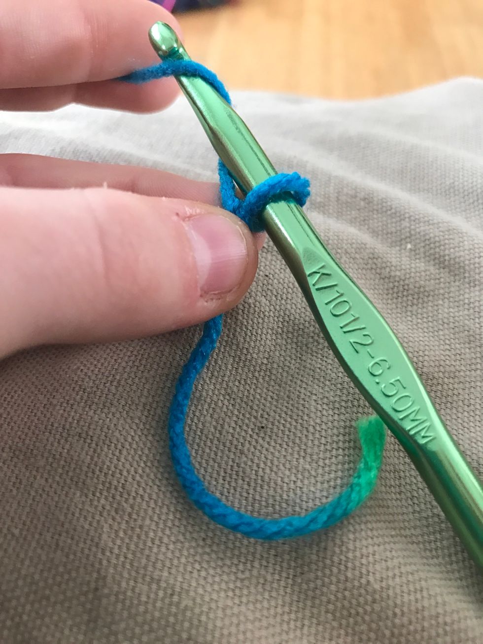 Twirl your yarn around the hook.