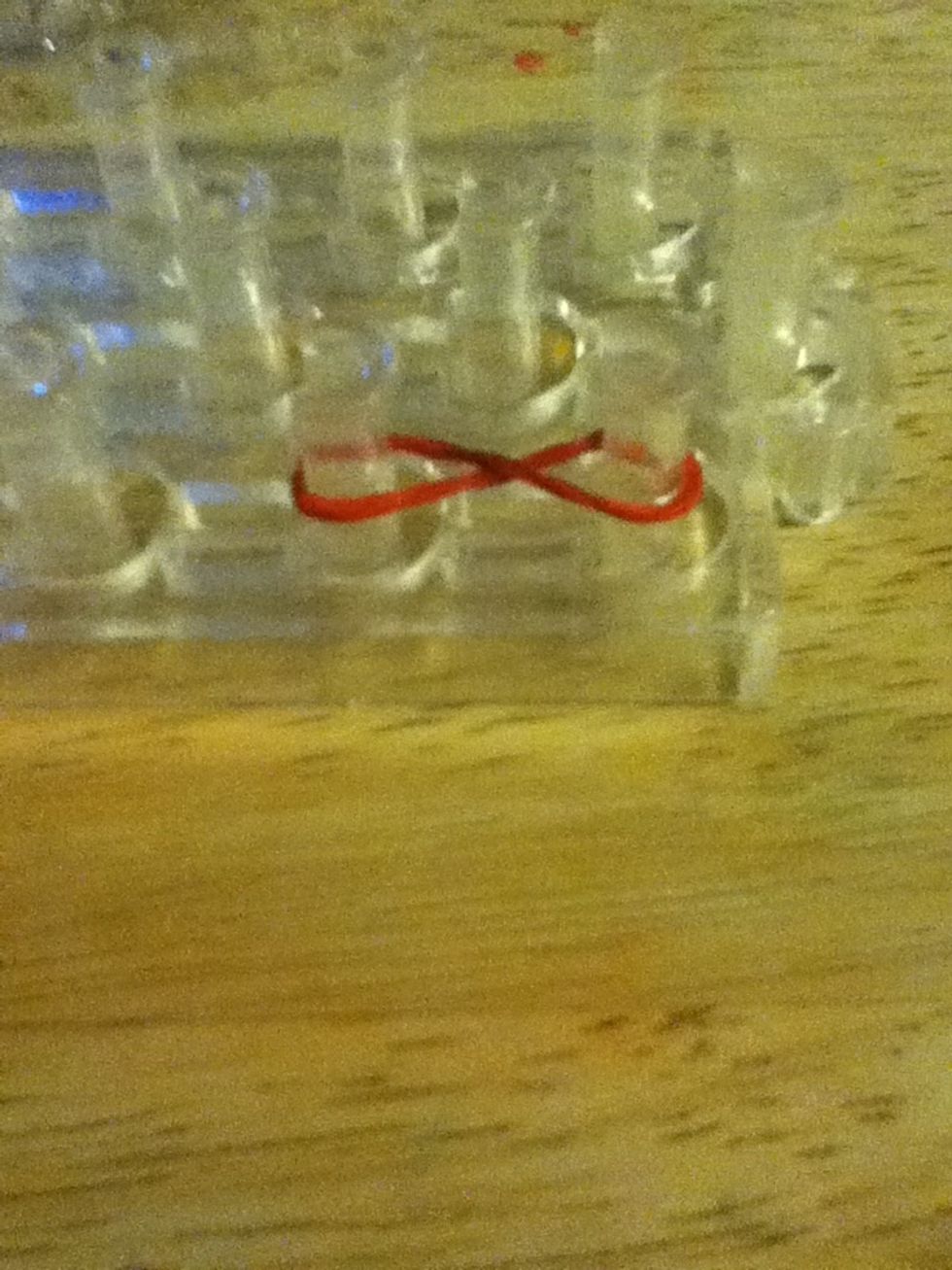 Twist a band into a infinity sign