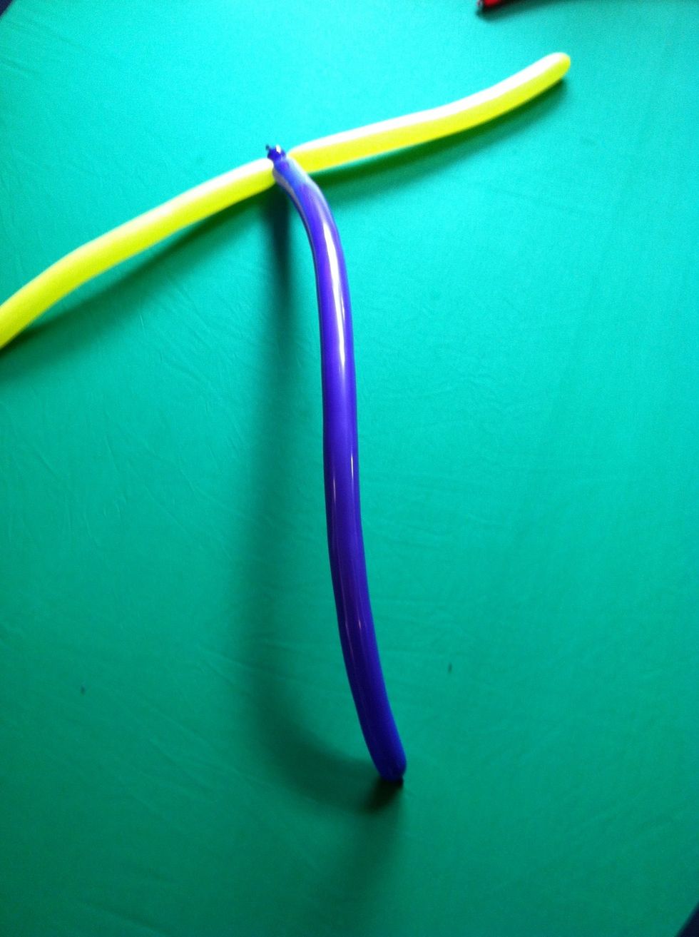 Twist a small bubble in the second balloon and attach it at the twist in the first balloon