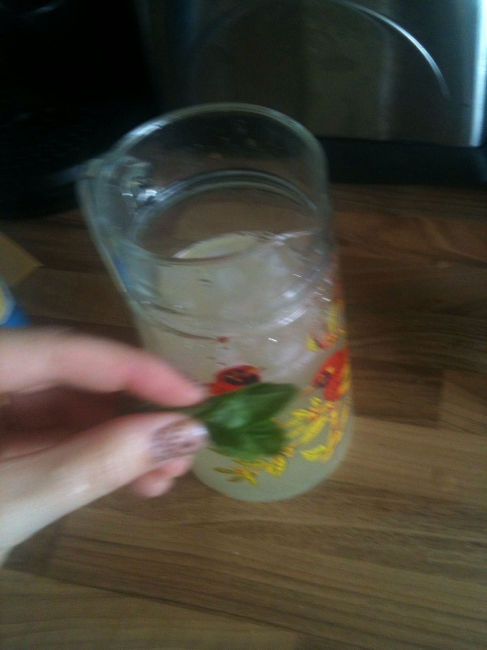 Twist and crush the mint leaves gently so that the fragrance is released but the leaves aren't broken.