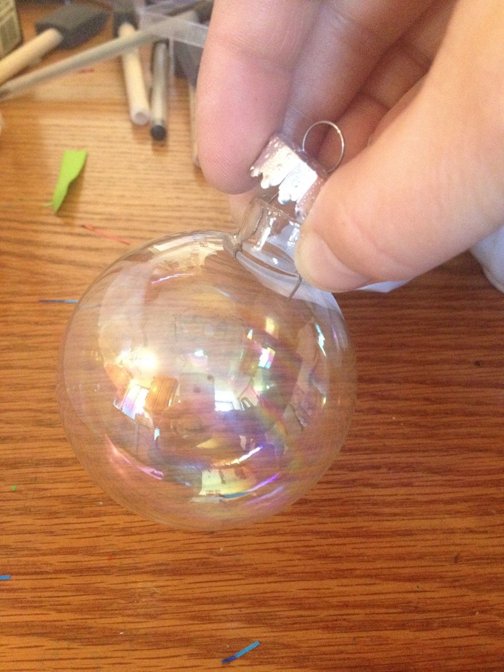 Twist and pull off the top part of it.