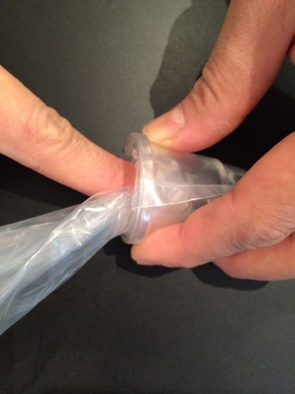 Twist and push in the nozzle so as the macaron batter doesn't leak out.