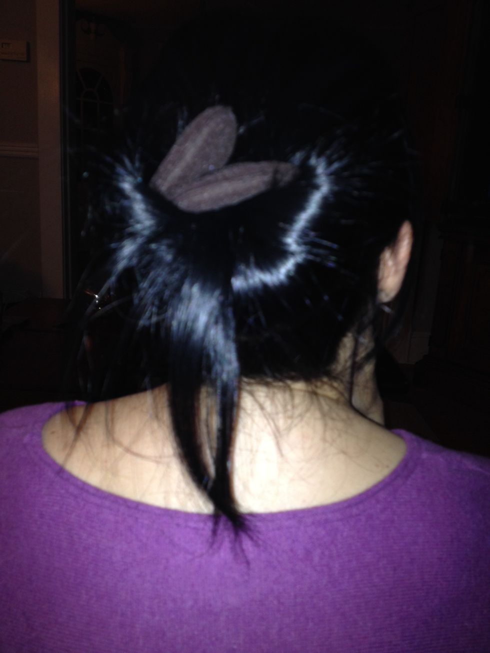 Twist and spread the hair out on the bun maker