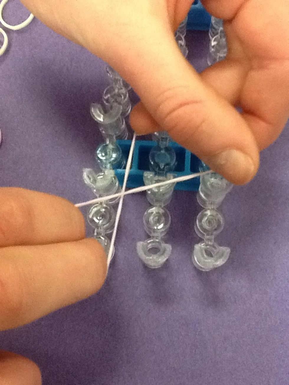 Twist band into a figure eight.