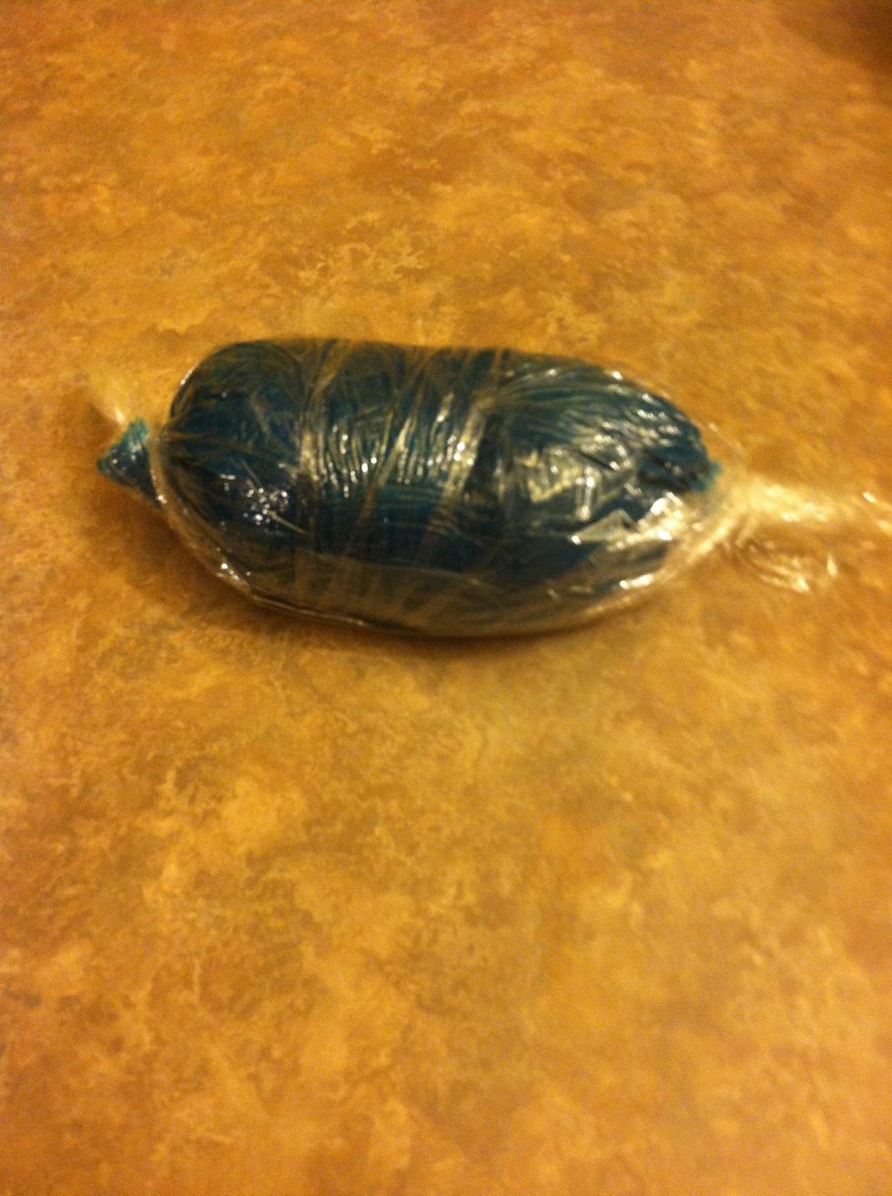 Twist icing in Saran  wrap.