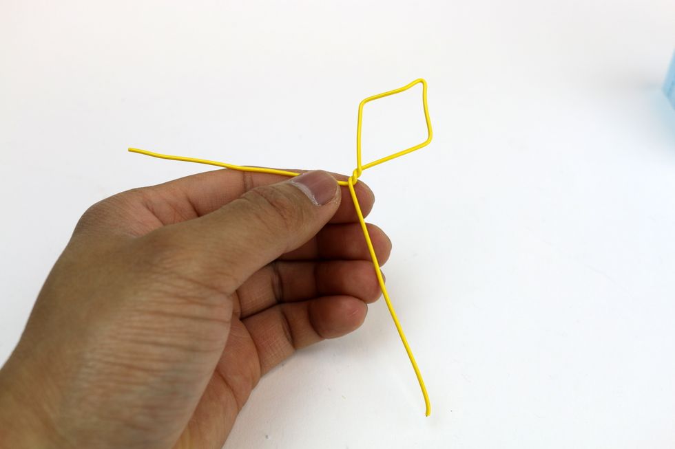 Twist it to lock in the kite shape.