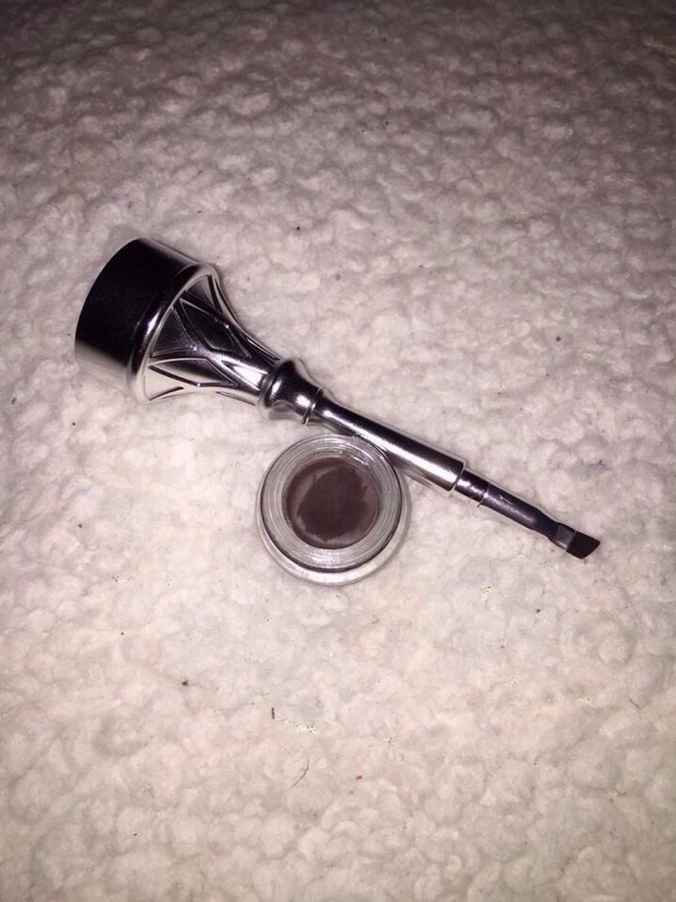 Twist open your eyebrow gel container and dip your brush into the cream-gel and use very little product. (Using very little product can go a long way!)