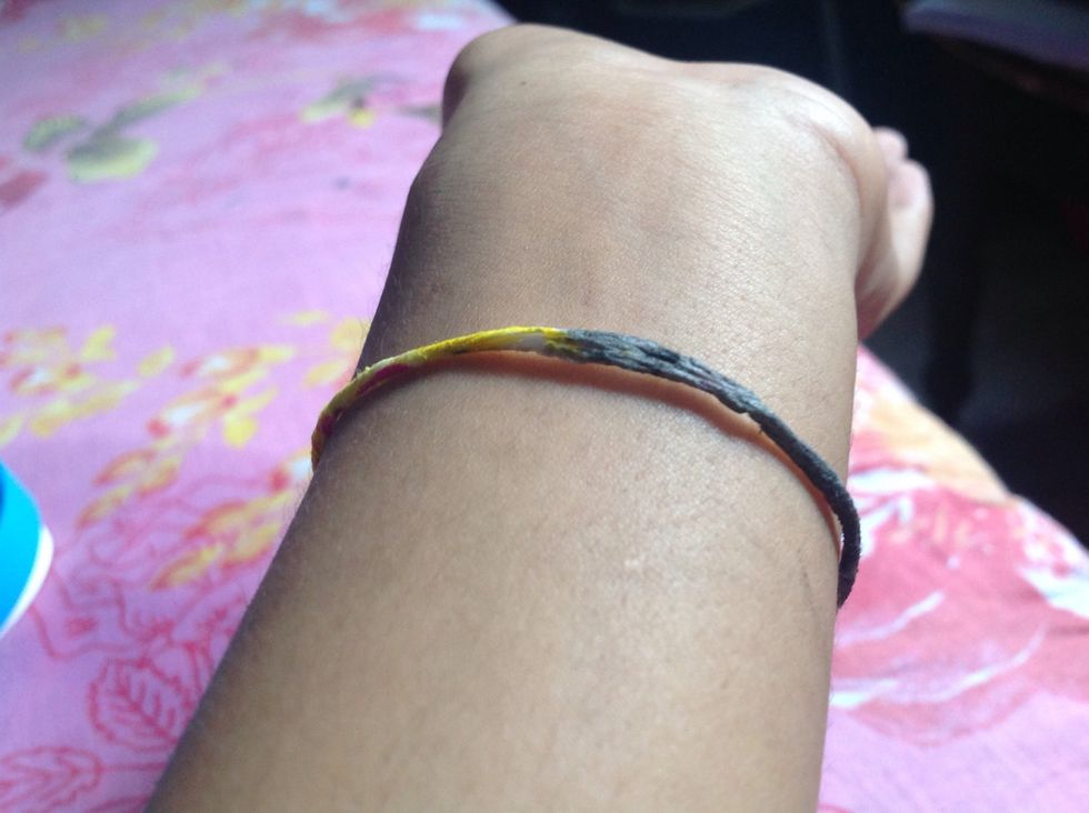 Twist the edges together to seal your fragile bracelet.