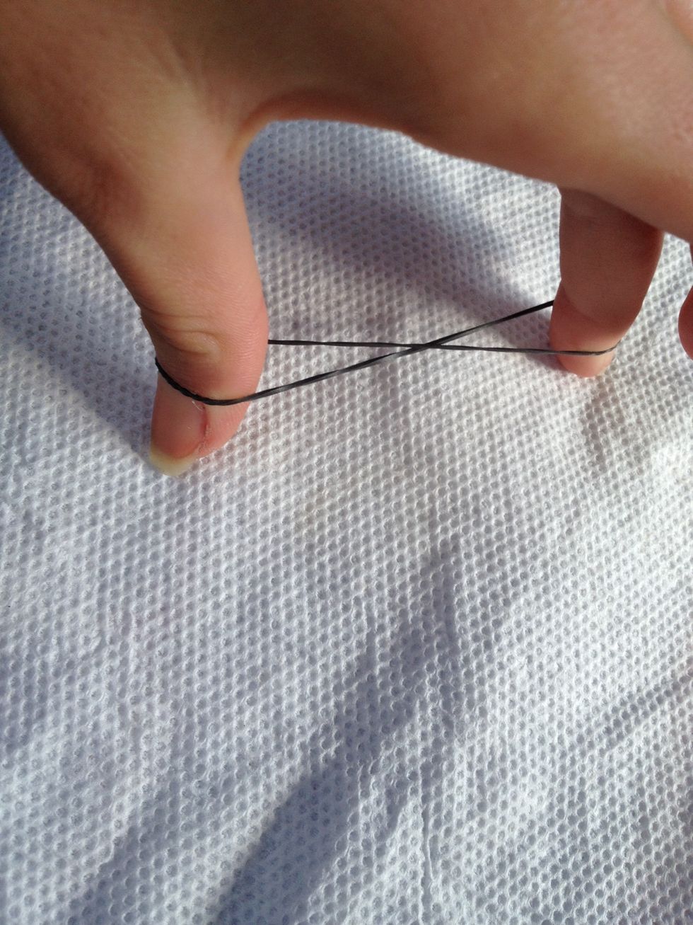 Twist the first cap band into a figure 8.