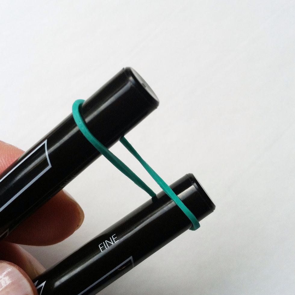 Twist the first elastic in a figure eight.