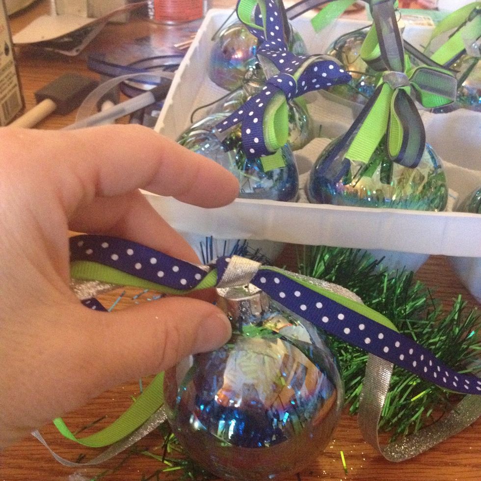 Twist the ribbon into a knot.