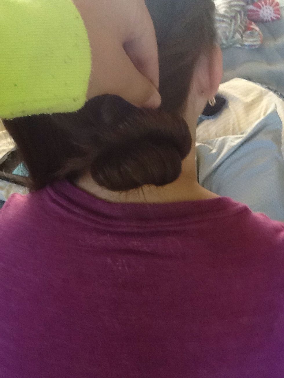 Twist the right section into a bun, and then twist the left section on top of that one into a bun.