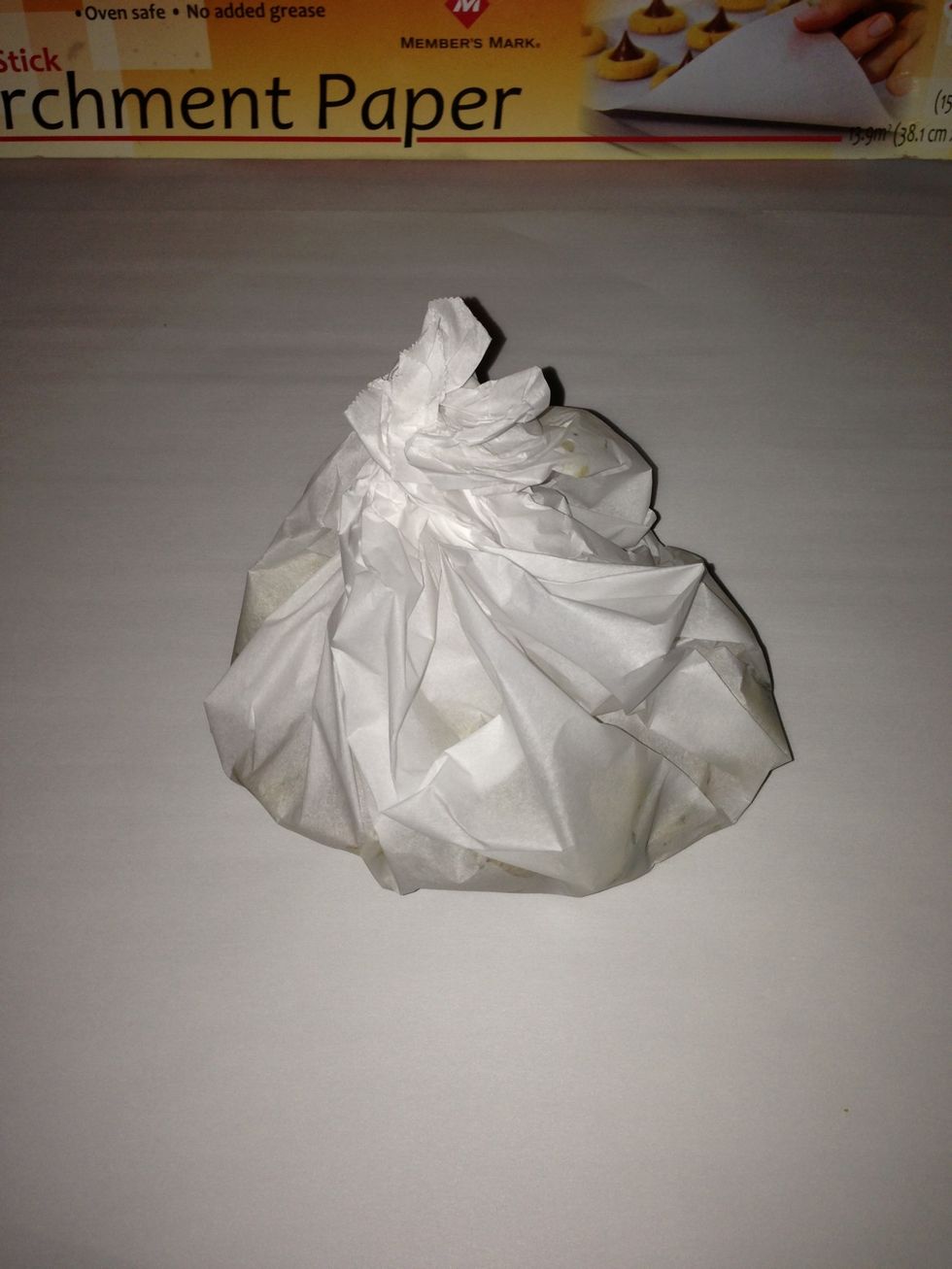 Twist the top tightly around, so you now have your potatoes wrapped up in a shape that's kind of like a Hershey's Kiss.