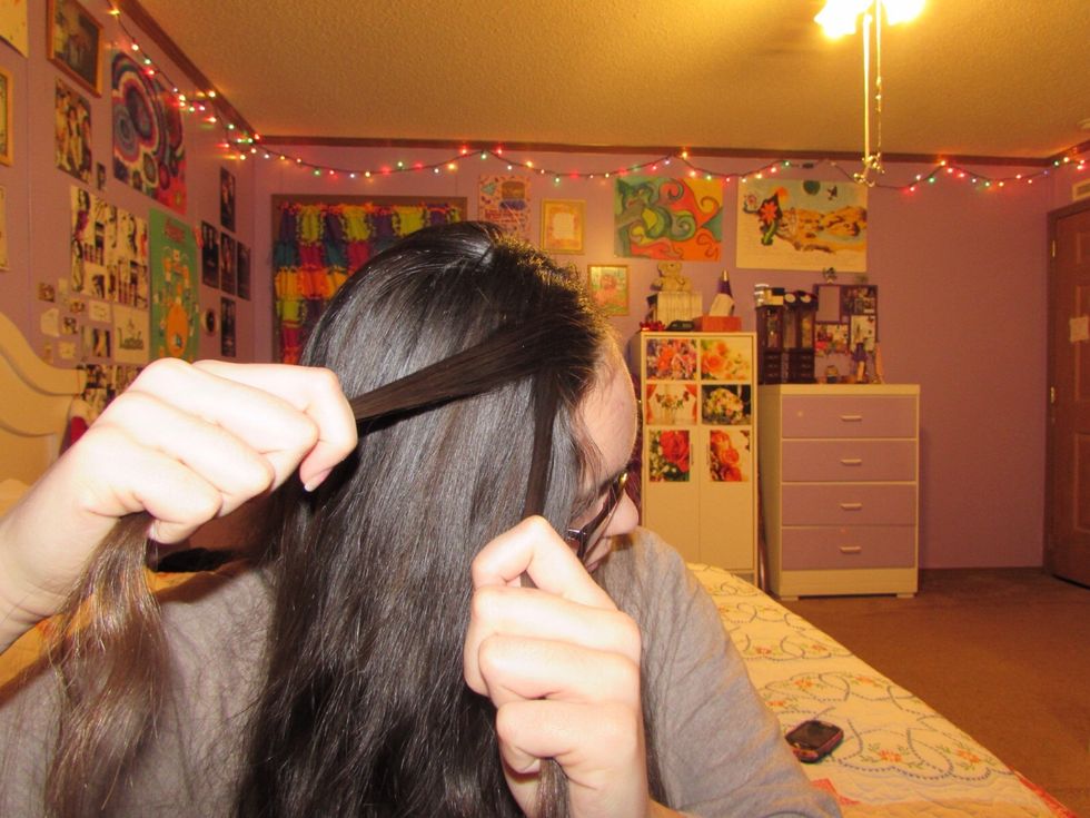 Twist the two away from your face. This braid is very similar to the lace braid because you only add in hair from the top. Twist then add. Twist then add. EASY PEASY!