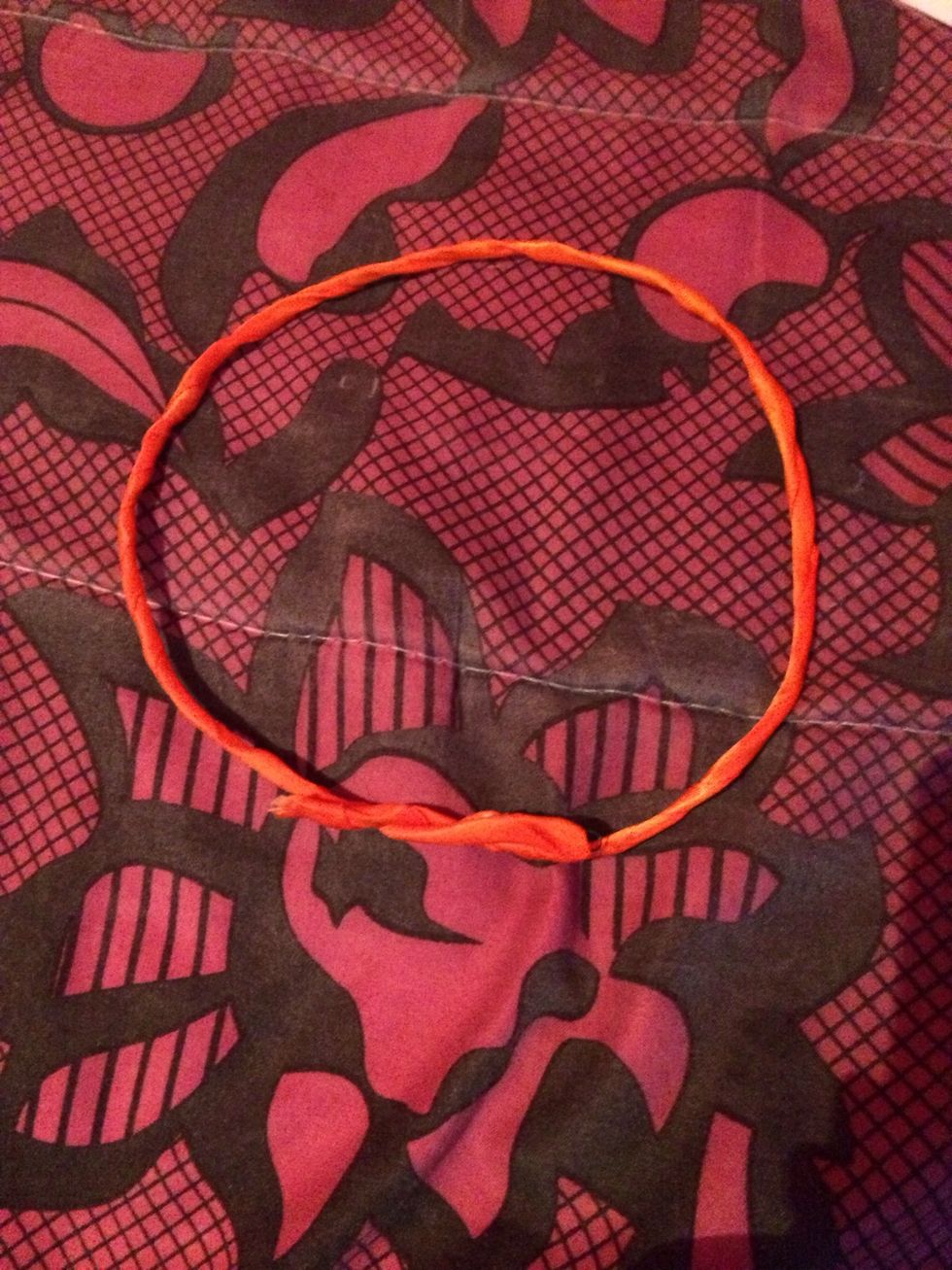 Twist the two ends of the wire to secure them.