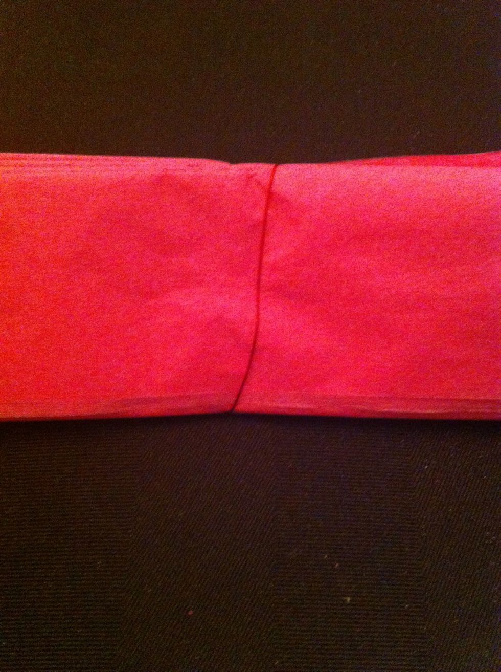 Twist the wire in the center of the fold