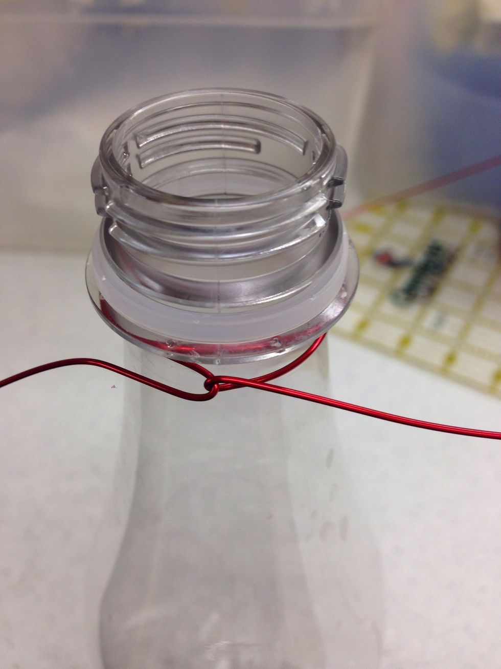 Twist the wire to keep it in place. Repeat steps four through seven with the remaining pieces of wire. You will have four wire bundles. Each bundle has two wires in it.