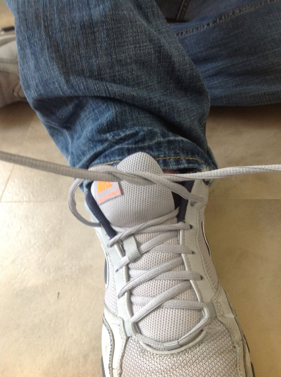 Twist them around each other one time.