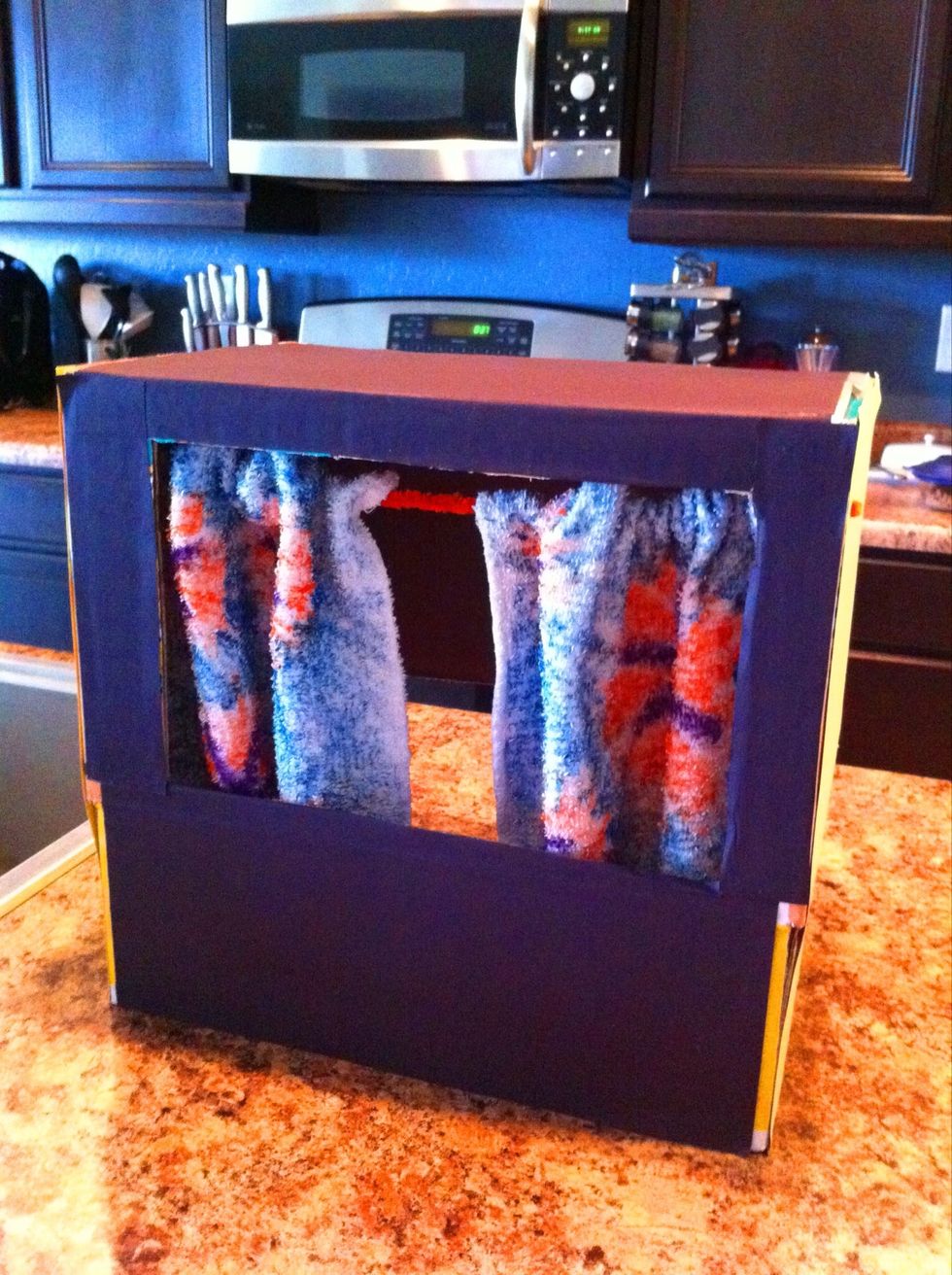 Twist two pipe cleaners together to make one long curtain rod. Fold wash cloths over about an inch & staple the hem closed over the pipe cleaner curtain rod.