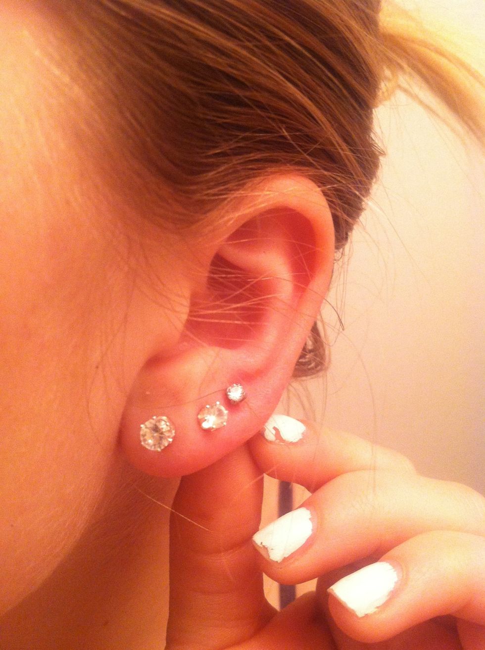 Twist your earrings after u have cleaned them to get the peroxide into the infected or new pierced part.